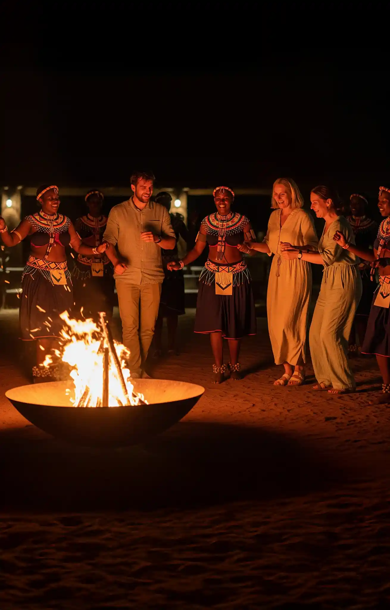 Guests enjoying authentic Botswana cultural evening at Motopi Farm